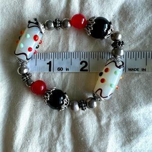 Superior bracelet black and coral beads great colors for fall